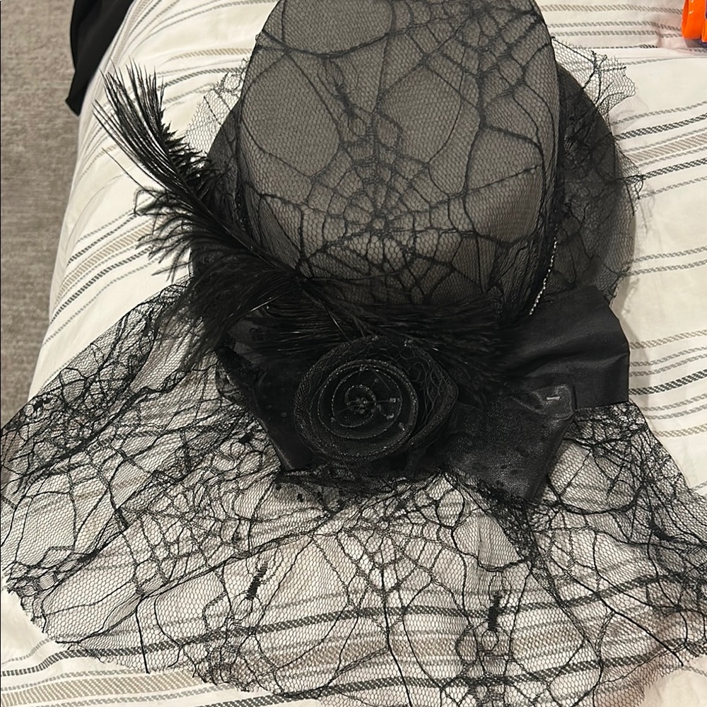 Elegant Black Lace Hat with Feather Accent